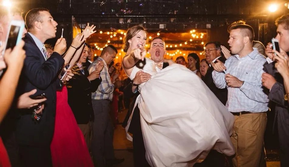 Gallery image of bride and groom leaving wedding